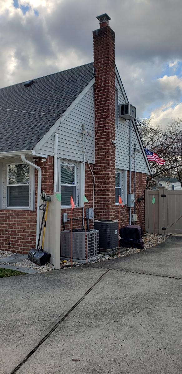 Professional chimney repointing restoring brick joints in Floral Park, NY