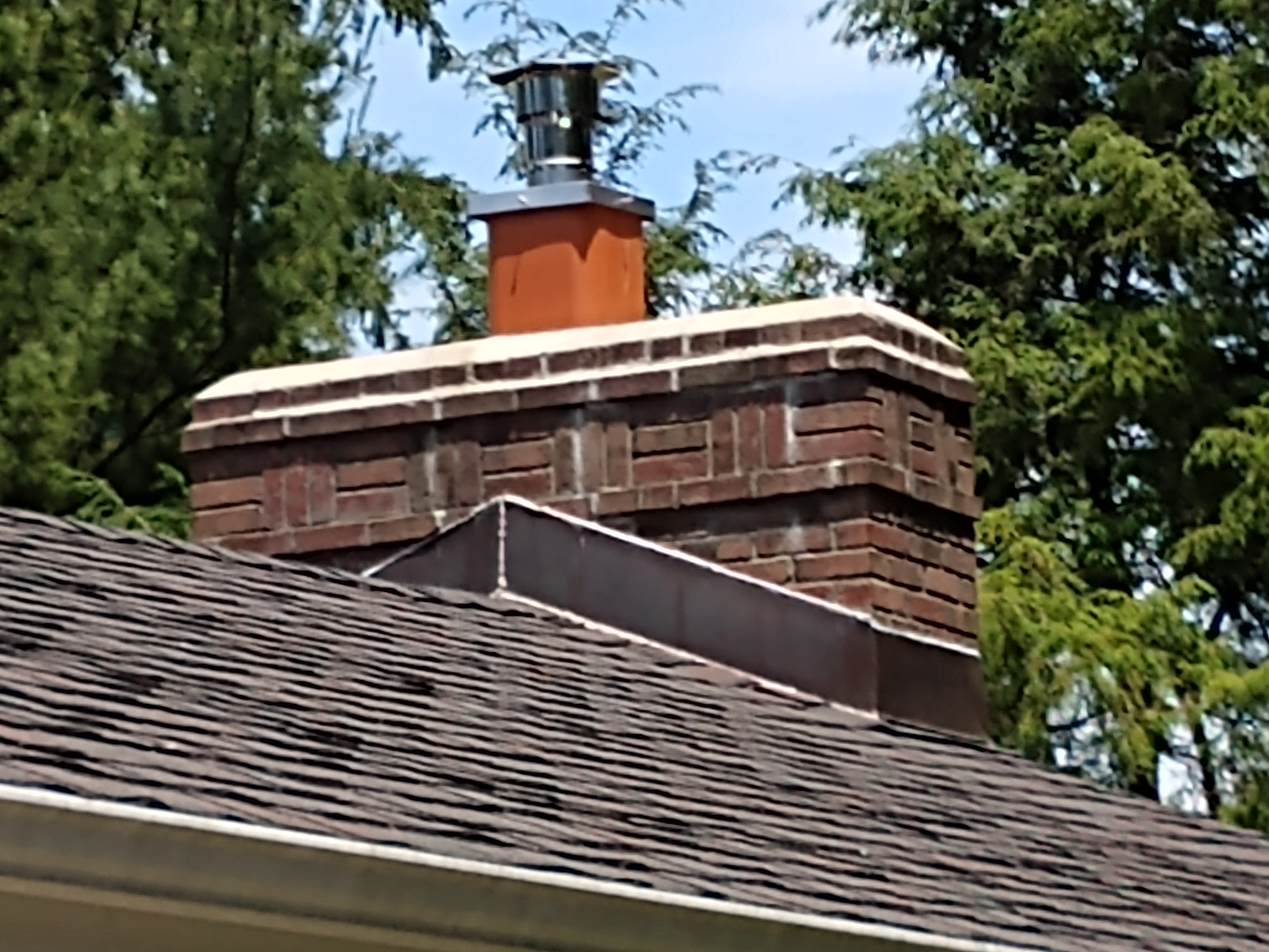 Stainless steel chimney cap with animal guard in Floral Park, New York